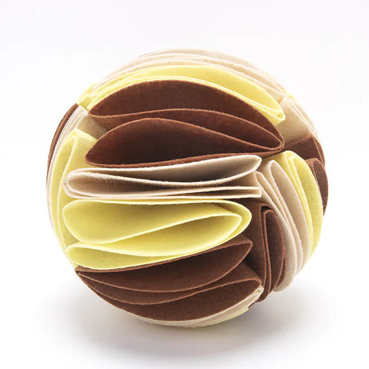 Beige, brown and yellow folded snuffle ball on a white background.